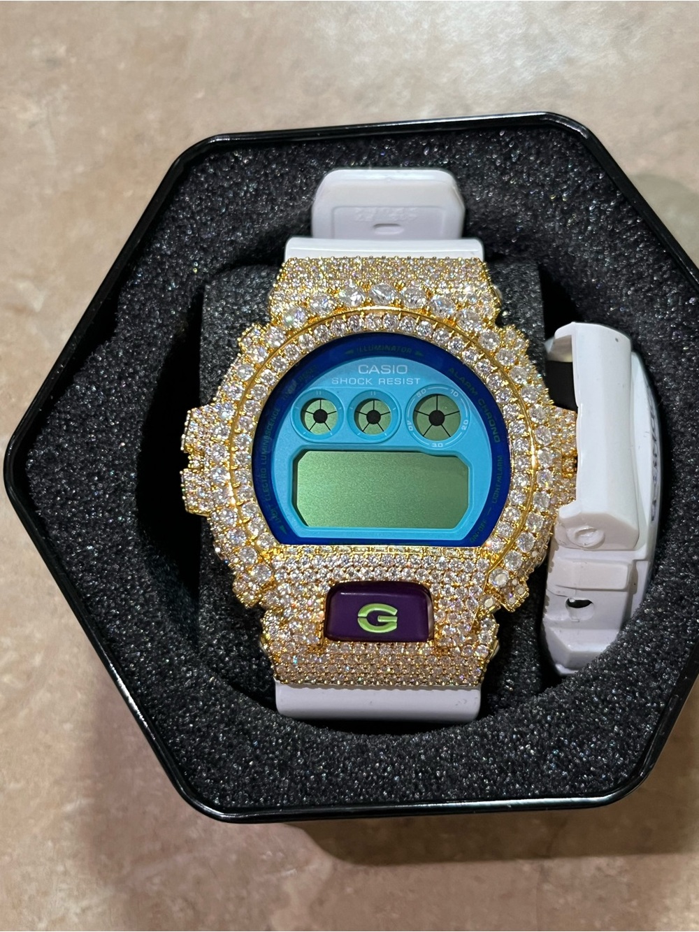 G-Shock White Band Watch with Gold Crystal Bezel and Blue Teal Dial